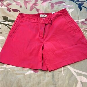 Hot pink shorts.